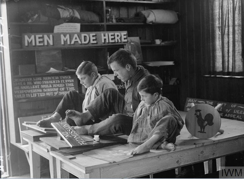 ‘Disabled boys being taught to paint and write with their toes at the Heritage School of Arts and Crafts for raid-shocked and crippled children, Kitchener Heritage, Chailey’, c. 1914-18, 