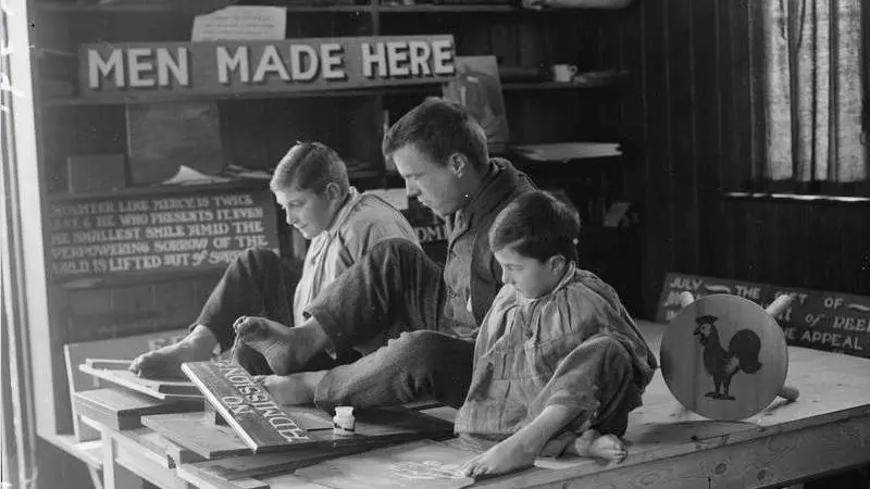 ‘Disabled boys being taught to paint and write with their toes at the Heritage School of Arts and Crafts for raid-shocked and crippled children, Kitchener Heritage, Chailey’, c. 1914-18, 