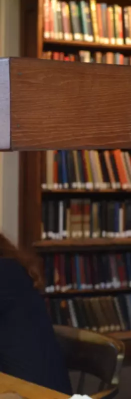 two students studying in the library