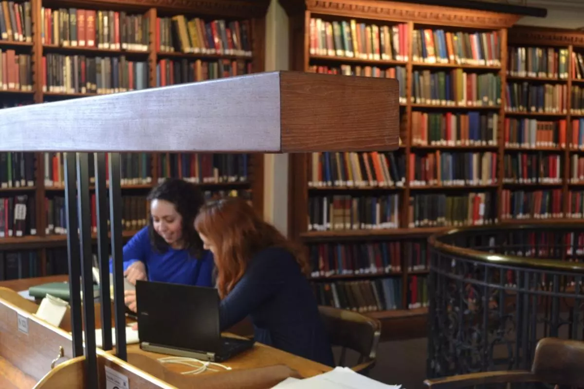 Two students studying in the history faculty library